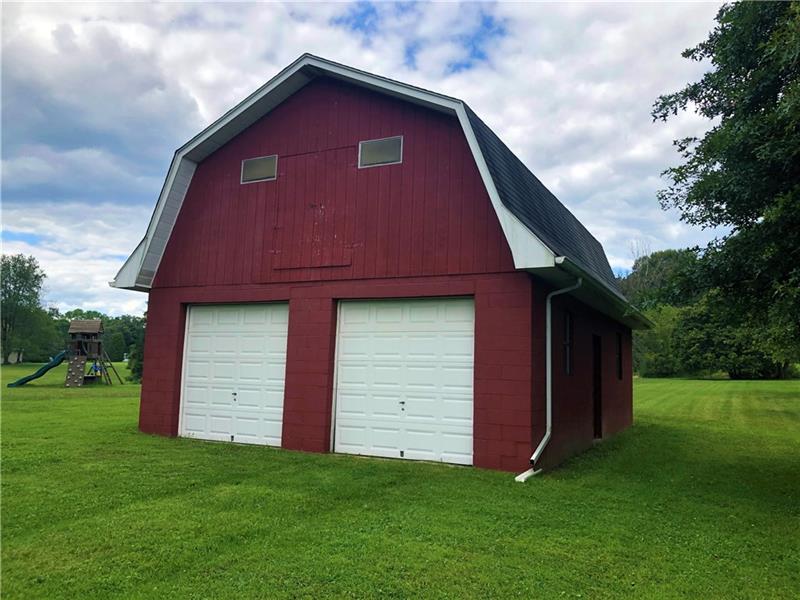 185 Overbrook Road Valencia, PA 16059 - Photo 22 of 25 Huge 23x31 2 story barn/2 bay garage. Concrete floors and electricity make it perfect for storing yard equipment and/or vehicles. Second level accessed by pull down steps, but plenty of room to install stairs if desired.