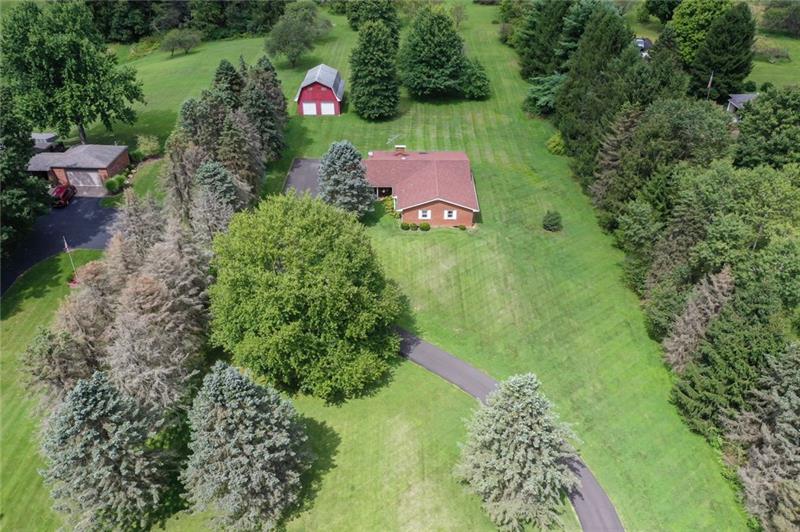 185 Overbrook Road Valencia, PA 16059 - Photo 23 of 25 Front acreage. Mature tress on either side of the property for privacy.