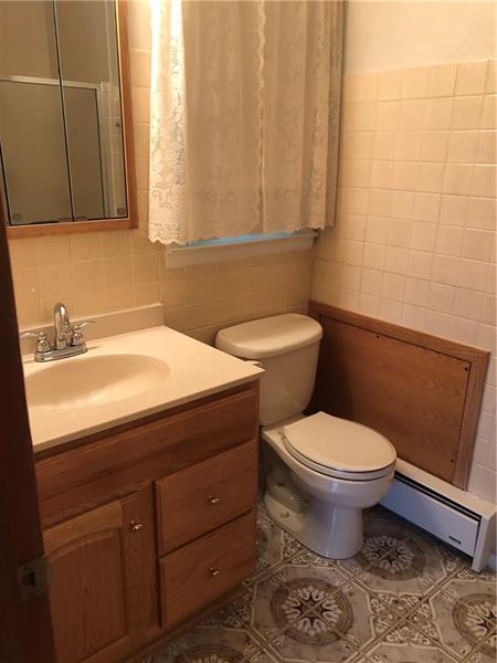 185 Overbrook Road Valencia, PA 16059 - Photo 6 of 25 Master bath has updated vanity top and toilet, ceramic tile floor and walk in shower.