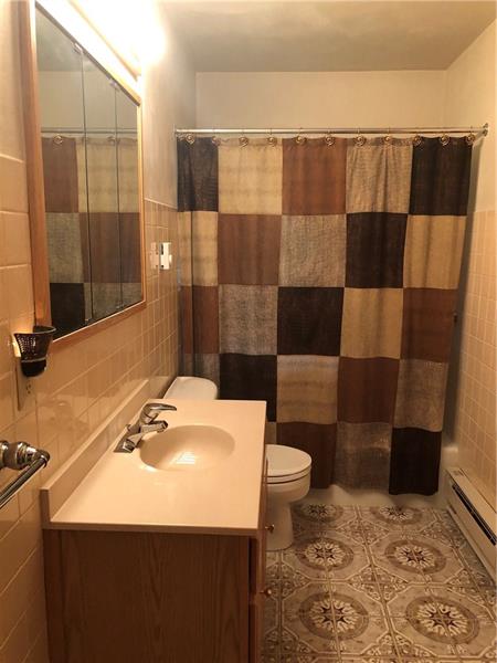 185 Overbrook Road Valencia, PA 16059 - Photo 8 of 25 Full bath with updated toilet and vanity top with Italian Ceramic tile floor.