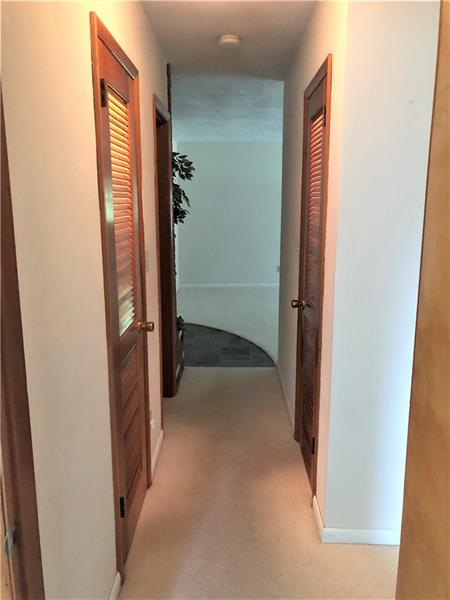 185 Overbrook Road Valencia, PA 16059 - Photo 10 of 25 Hallway view from Master bedroom showing the 2 generously sized closets. Bedrooms 2 and 3 are to the right. Entryway/ Formal living room are straight ahead.