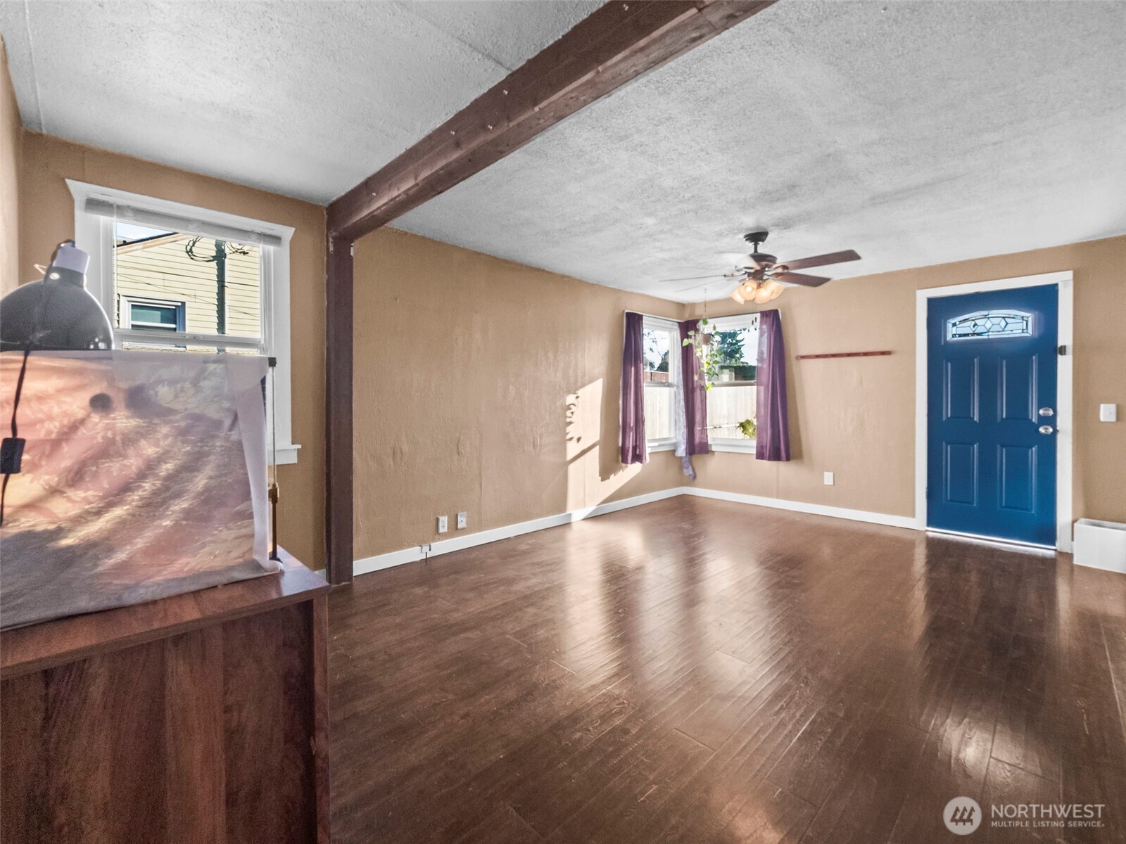 1022 Sheridan Road Bremerton, WA 98310 - Photo 11 of 28 a view of an empty room with window and wooden floor