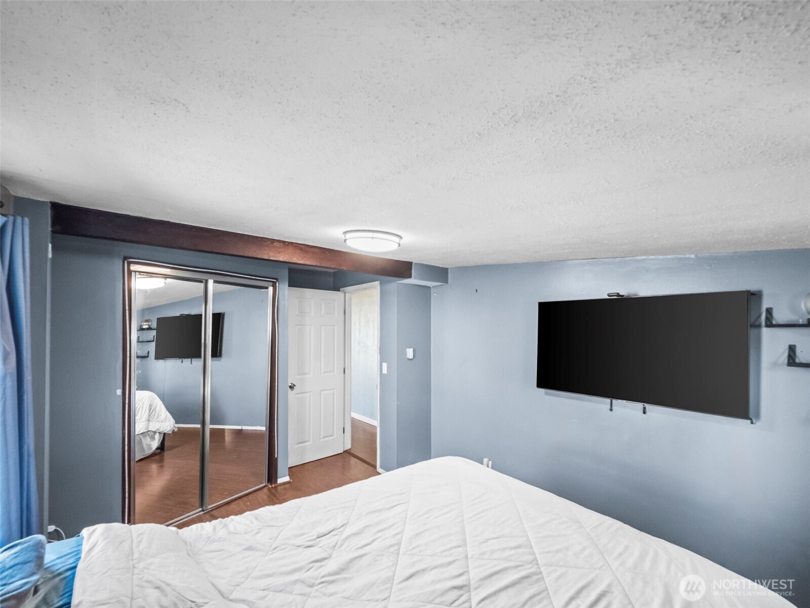 1022 Sheridan Road Bremerton, WA 98310 - Photo 17 of 28 a bedroom with a bed and a flat screen tv