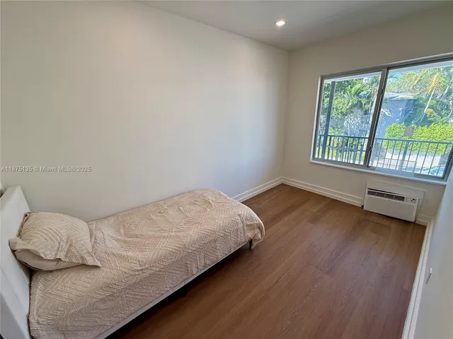a view of room with hardwood floor
