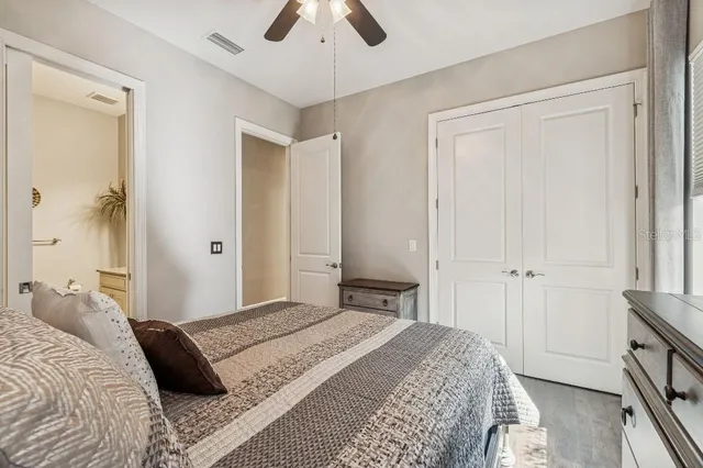 a bedroom with a bed and a dresser