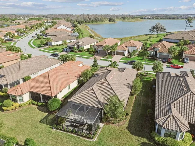 an aerial view of a house with a ocean view