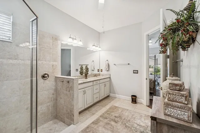 a view of walk in closet with clothes