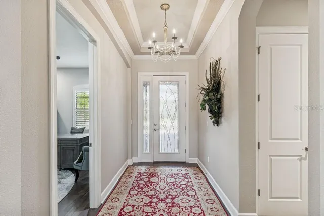 walk in closet with white walls
