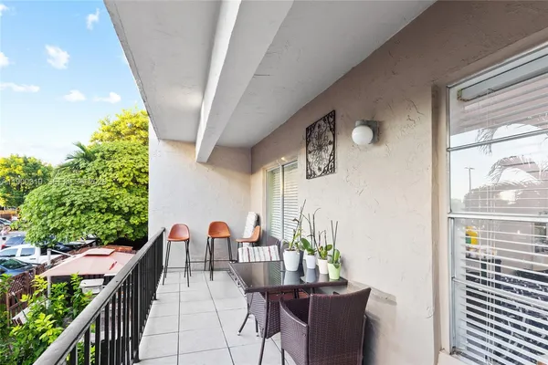 a view of a balcony with chairs