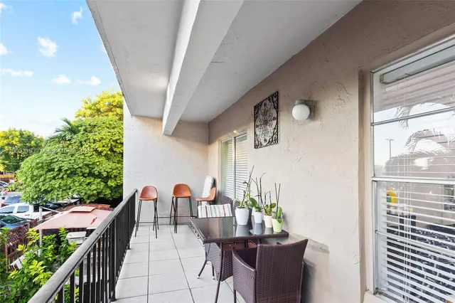 a view of a balcony with chairs