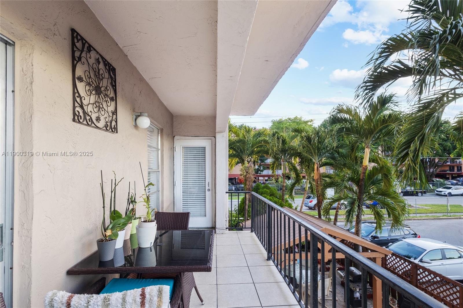 5665 West 20th Avenue, Unit 212 Hialeah, FL 33012 - Photo 24 of 38 a view of a balcony with chairs