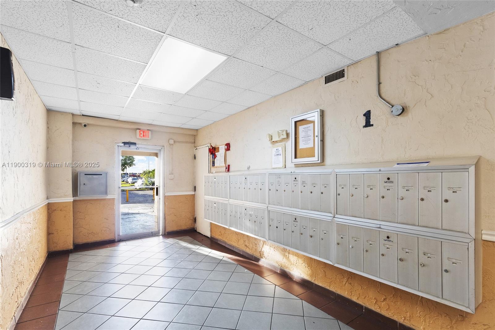 5665 West 20th Avenue, Unit 212 Hialeah, FL 33012 - Photo 27 of 38 a view of kitchen with cabinet and stairs