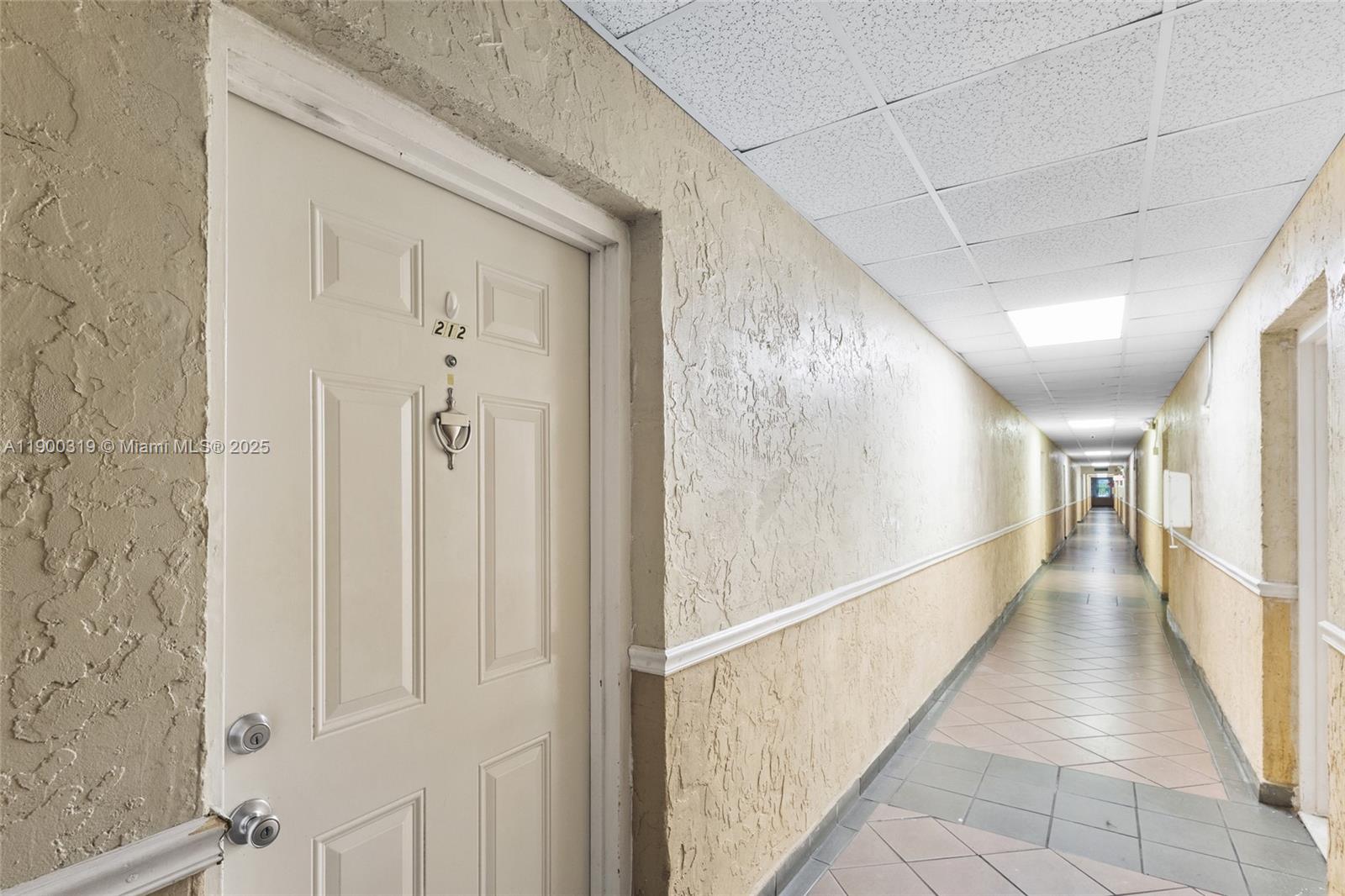 5665 West 20th Avenue, Unit 212 Hialeah, FL 33012 - Photo 28 of 38 a view of a hallway