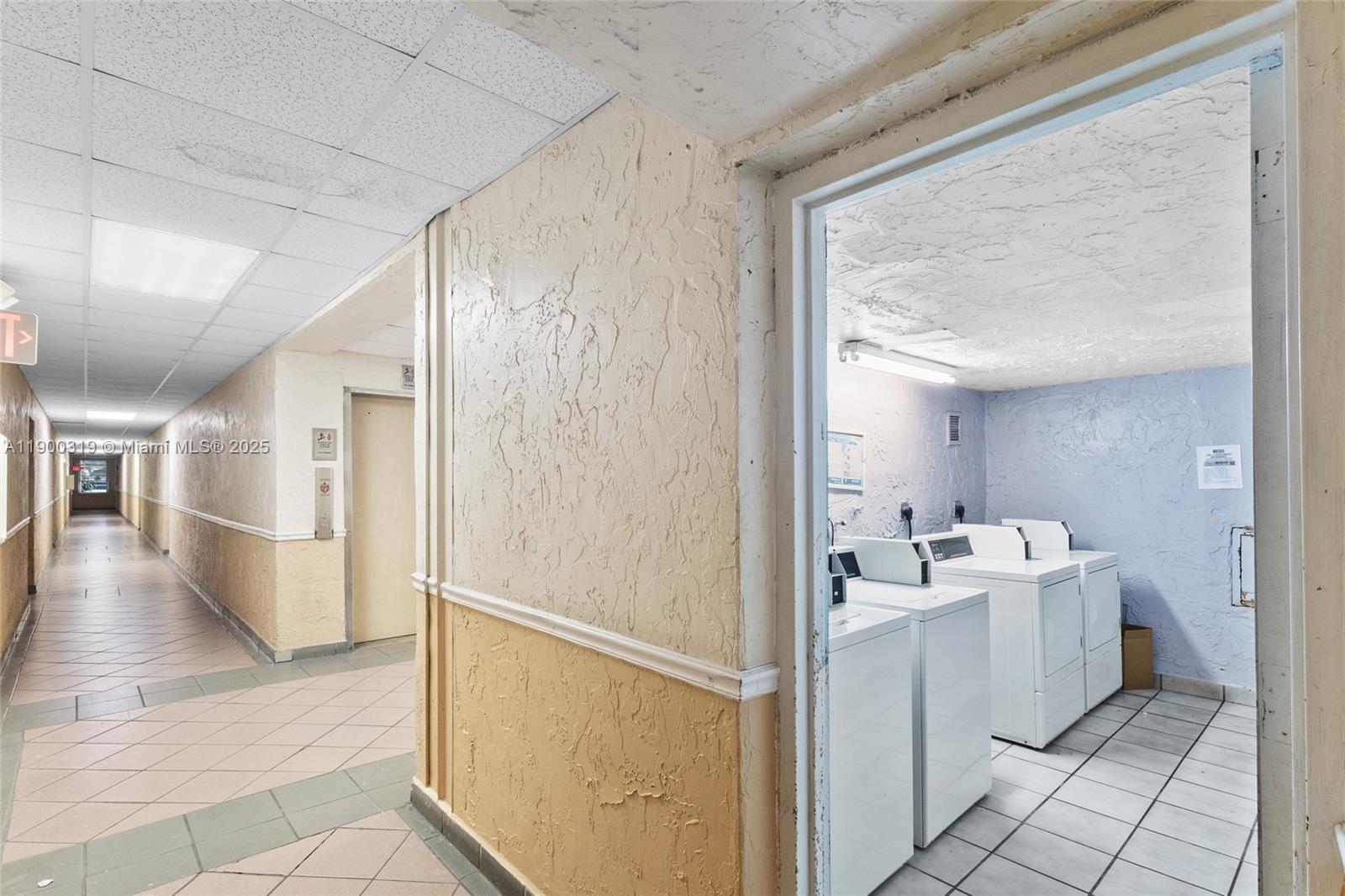 5665 West 20th Avenue, Unit 212 Hialeah, FL 33012 - Photo 29 of 38 a bathroom with a sink a mirror and a toilet