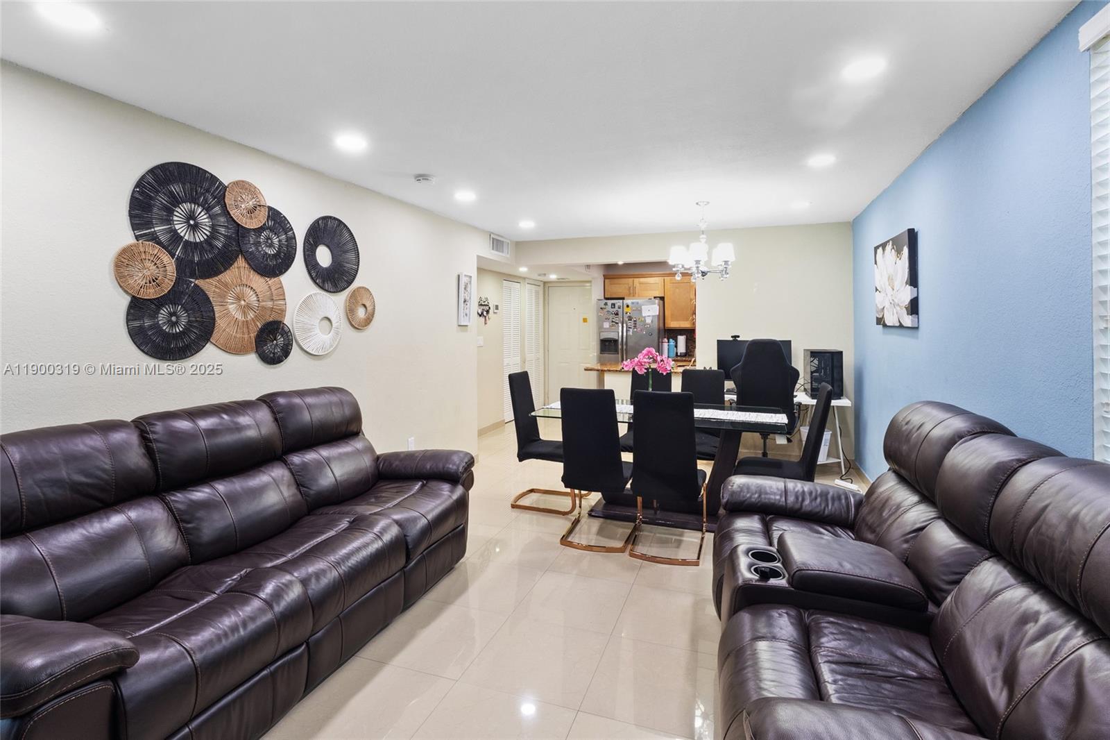 5665 West 20th Avenue, Unit 212 Hialeah, FL 33012 - Photo 3 of 38 a living room with furniture