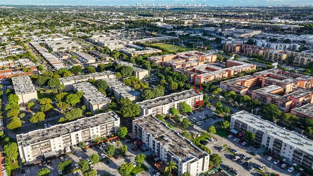 an aerial view of residential houses with outdoor space