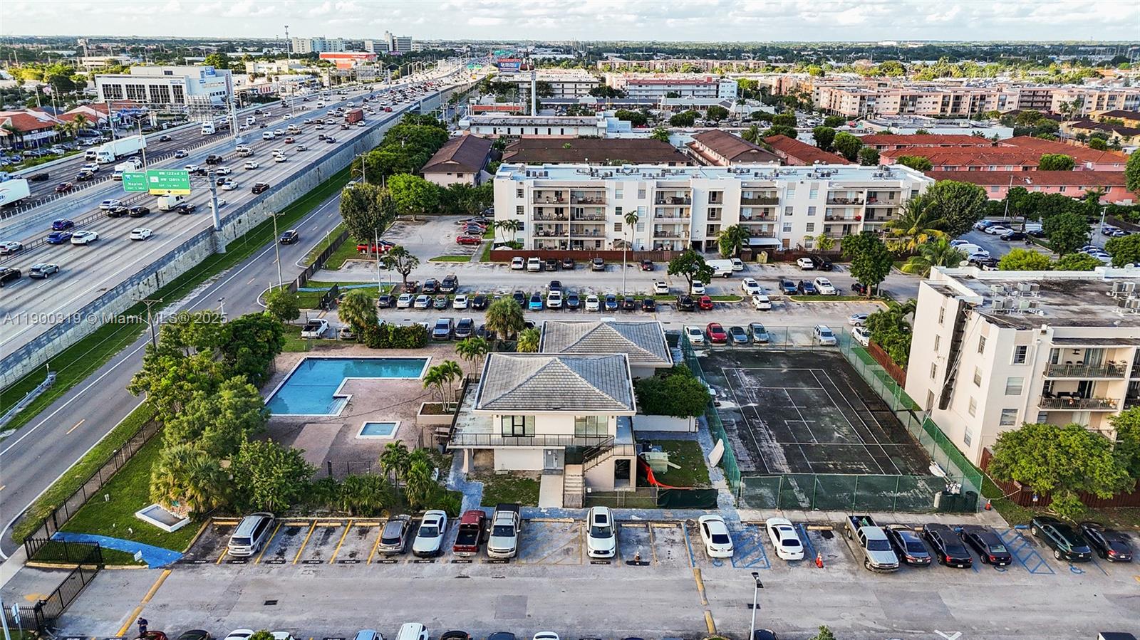 5665 West 20th Avenue, Unit 212 Hialeah, FL 33012 - Photo 36 of 38 an aerial view of a city
