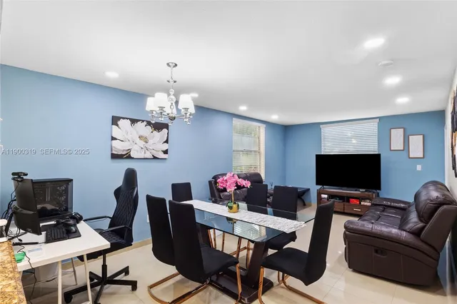 a view of a workspace with furniture