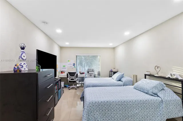 a living room with couches and a flat screen tv
