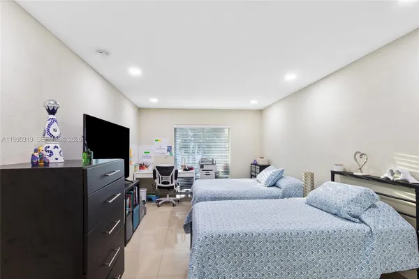 a living room with couches and a flat screen tv