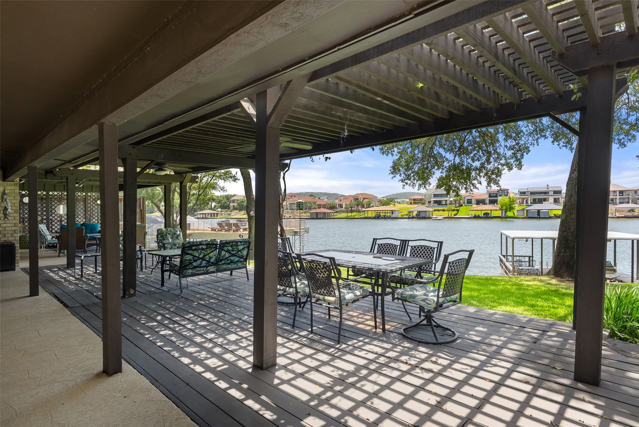 141 Perry Lane Kingsland, TX 78639 - Photo 25 of 40 A spacious covered deck offers direct access to waterfront living with picturesque views.