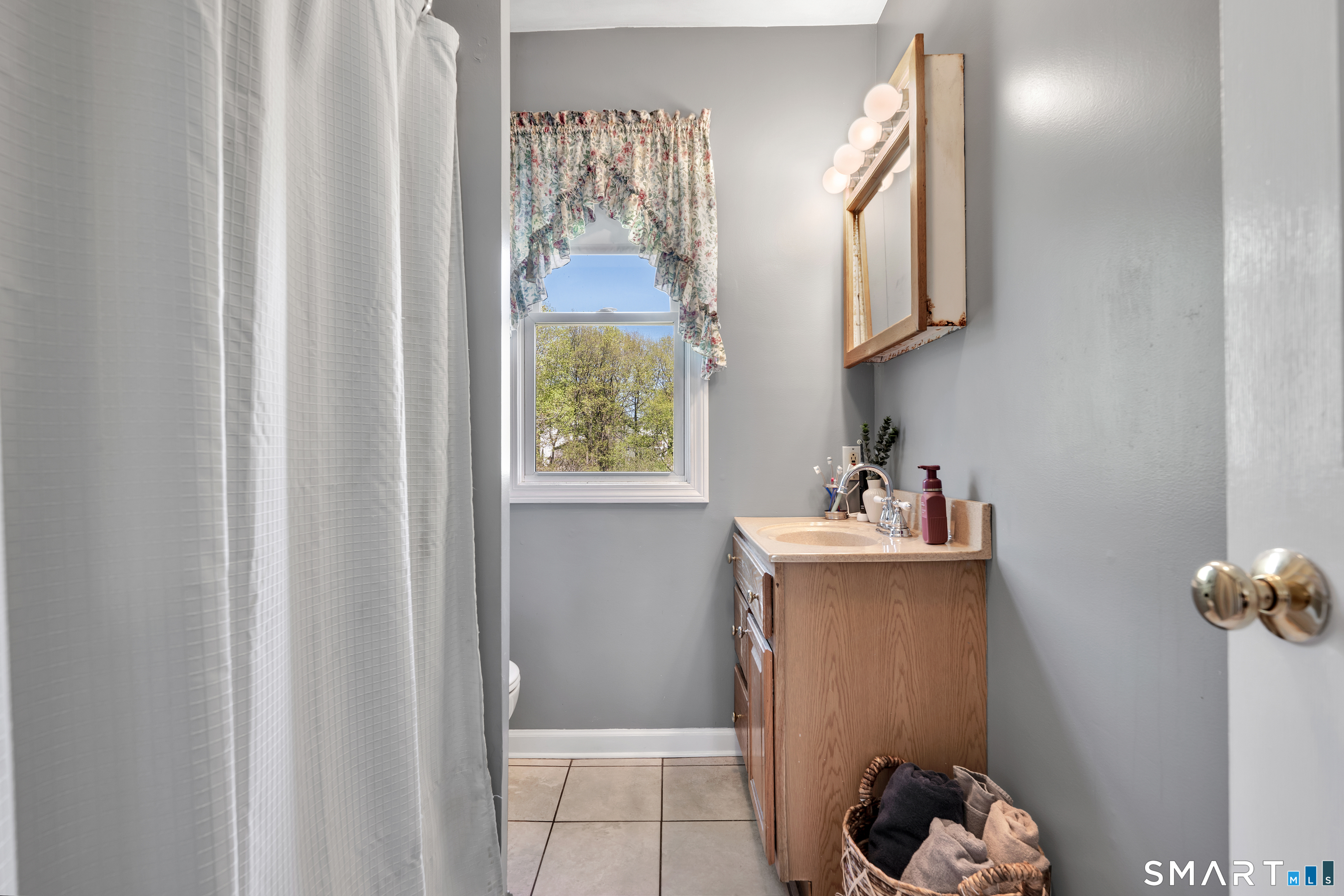 28 Maple Street Torrington, CT 06790 - Photo 13 of 23 a bathroom with a sink toilet and mirror