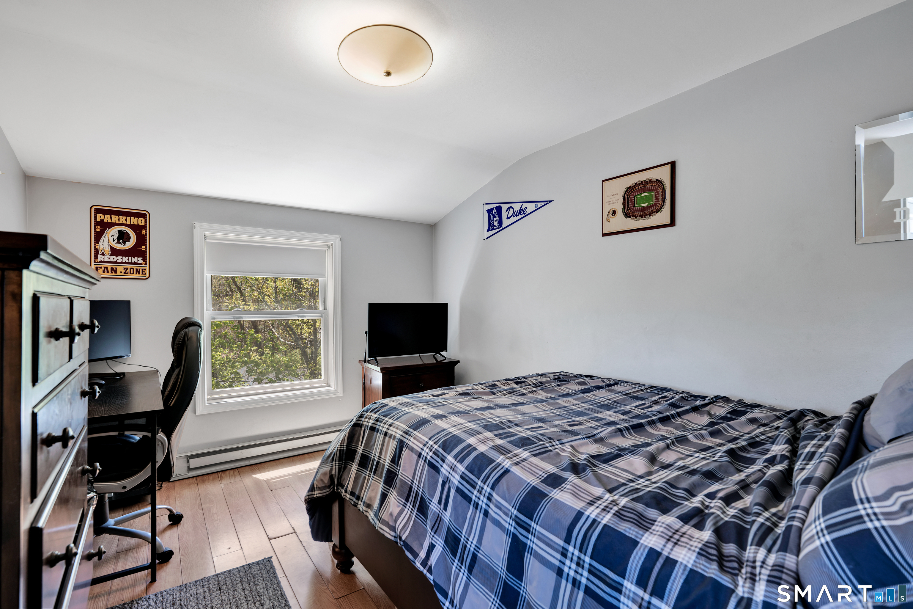 28 Maple Street Torrington, CT 06790 - Photo 14 of 23 a bedroom with a bed and a desk