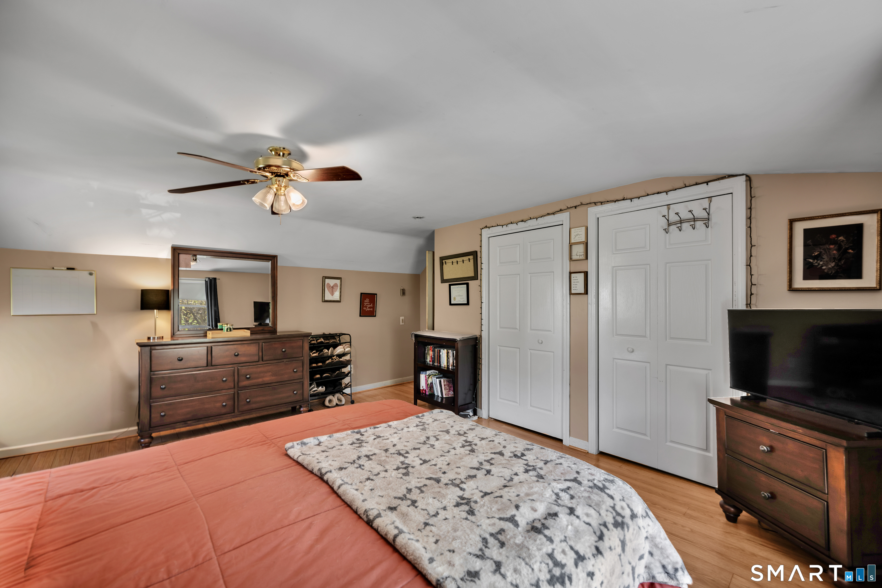28 Maple Street Torrington, CT 06790 - Photo 17 of 23 a bedroom with a bed and a flat screen tv