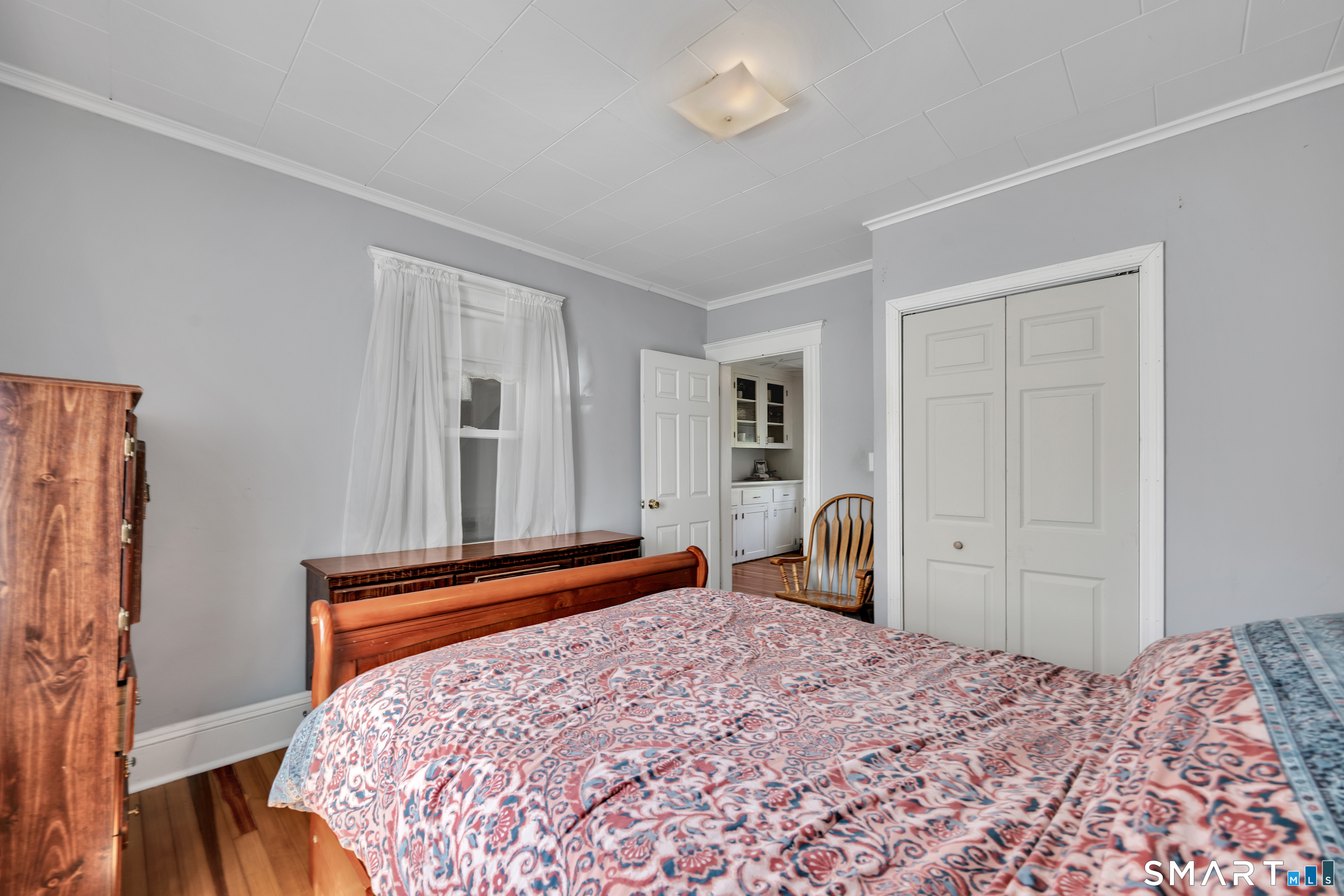 28 Maple Street Torrington, CT 06790 - Photo 21 of 23 a bedroom with a bed and a dresser