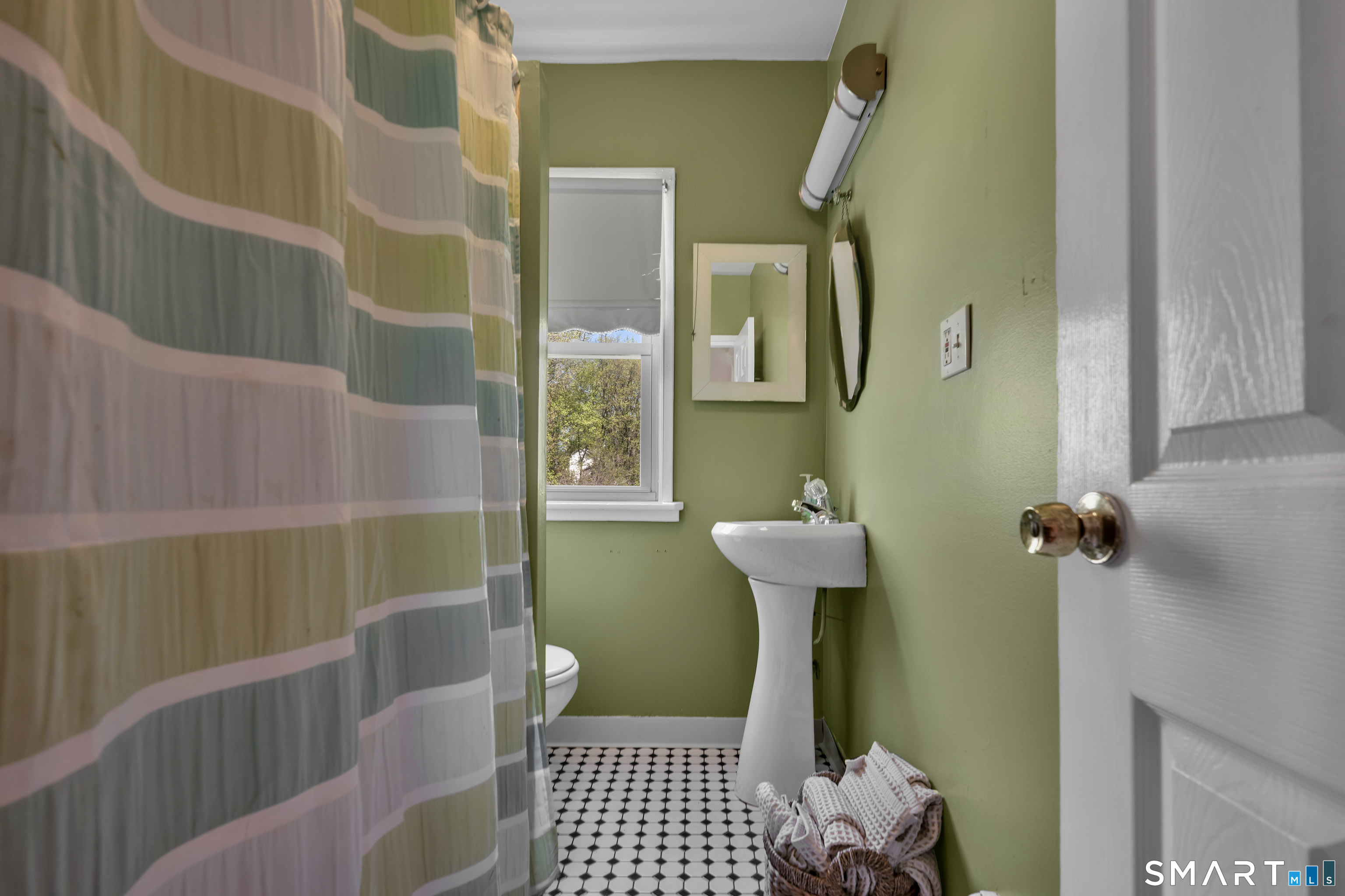 28 Maple Street Torrington, CT 06790 - Photo 23 of 23 a bathroom with sink toilet and shower