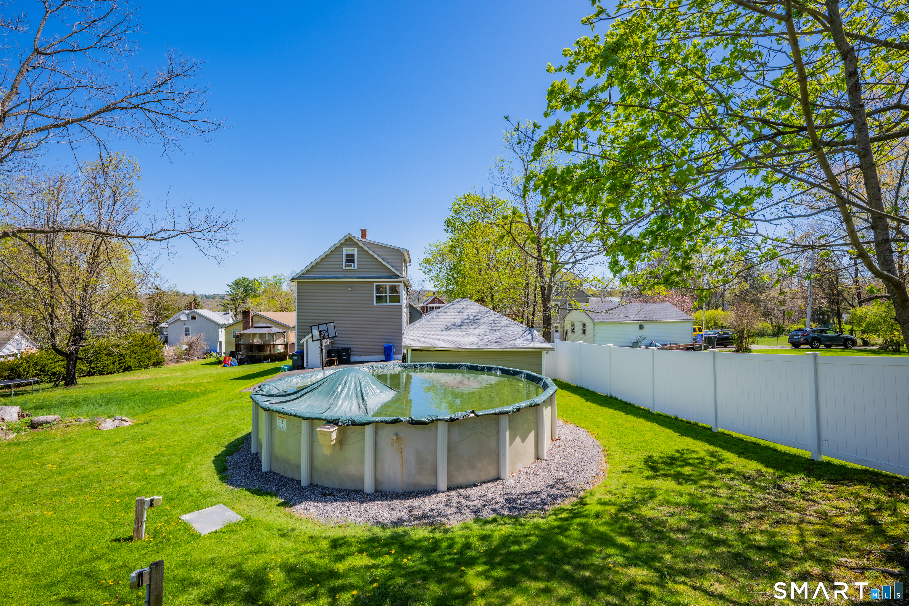 28 Maple Street Torrington, CT 06790 - Photo 5 of 23 a view of a backyard with wooden fence