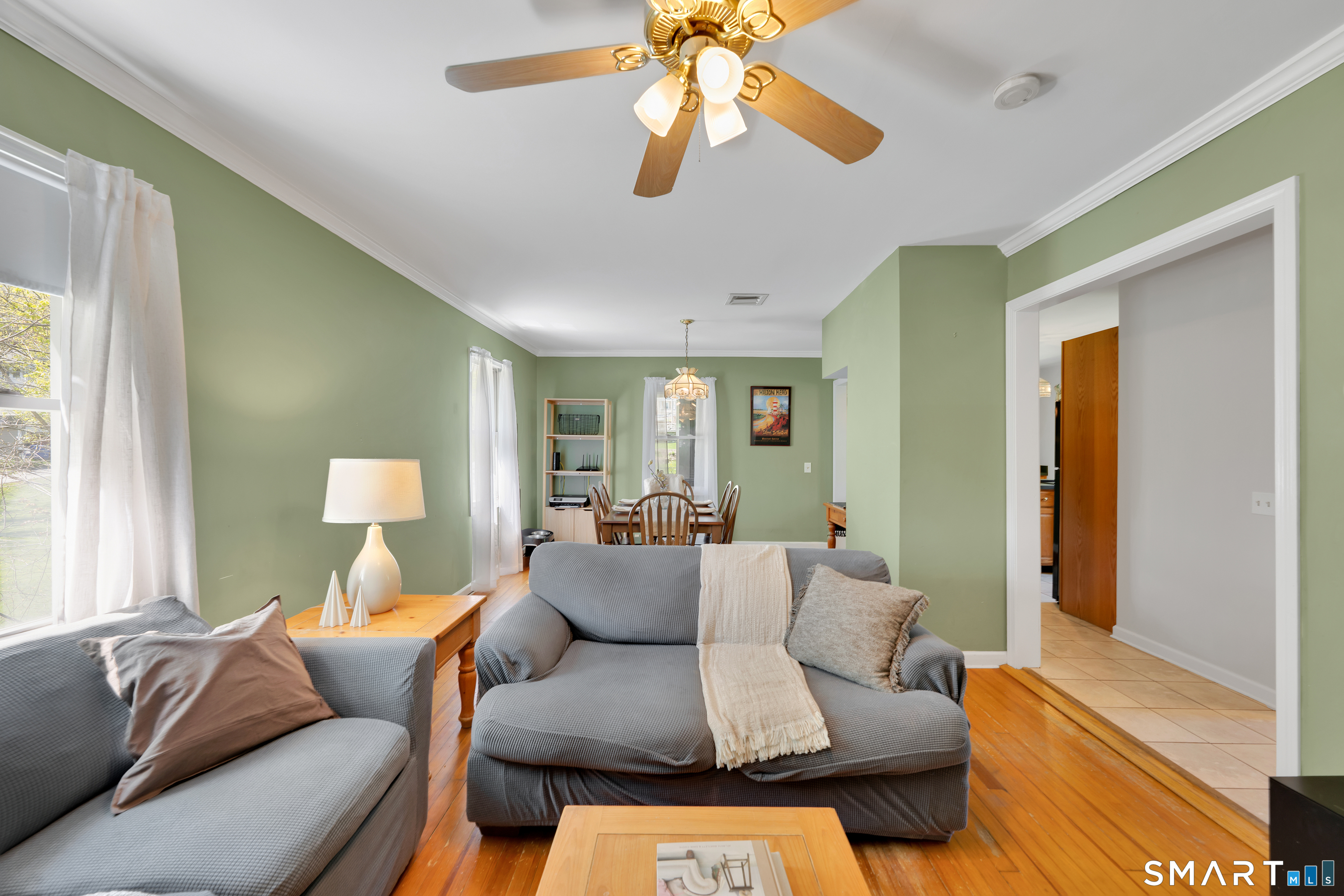 28 Maple Street Torrington, CT 06790 - Photo 7 of 23 a living room with furniture and a large window