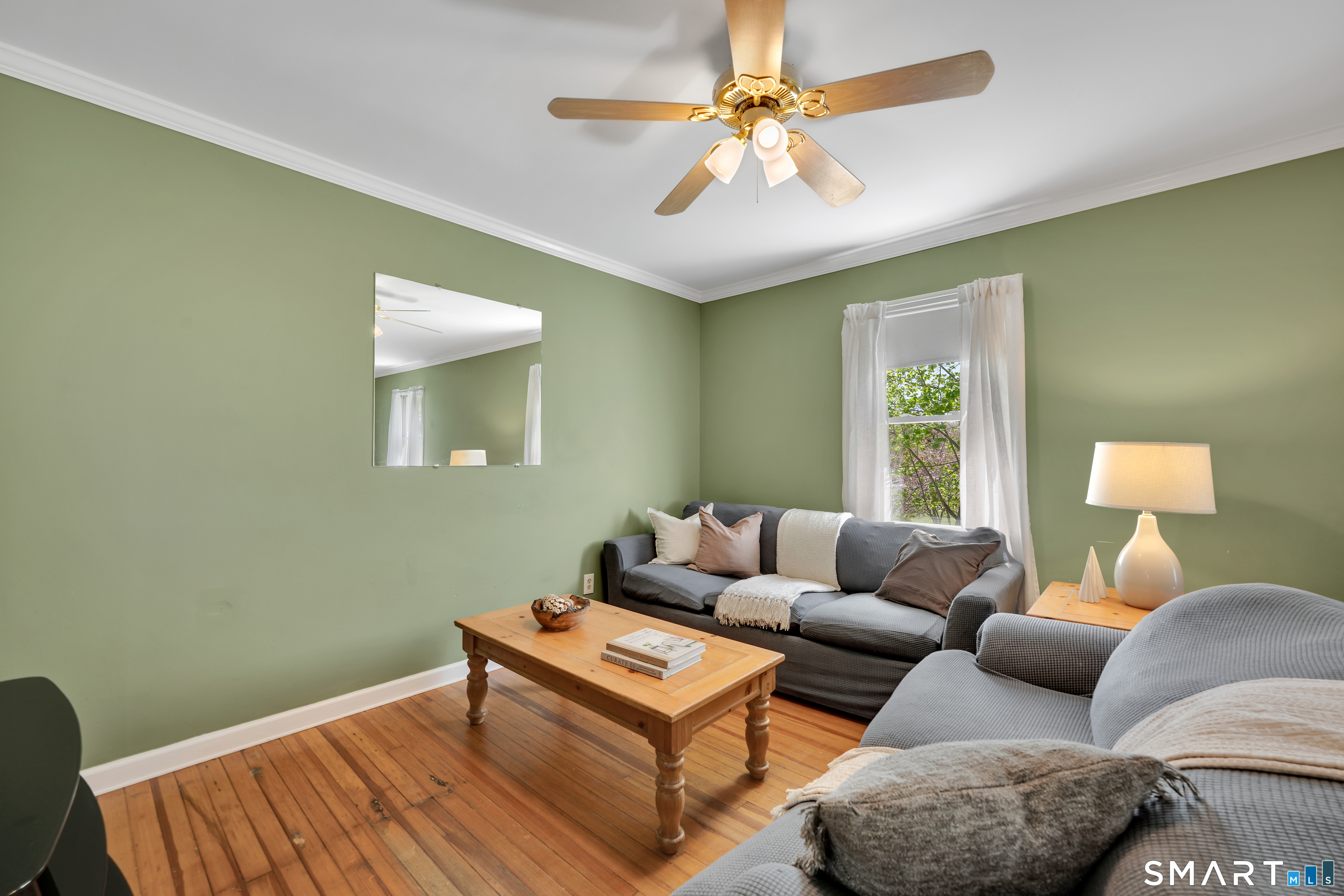 28 Maple Street Torrington, CT 06790 - Photo 9 of 23 a living room with furniture and a window