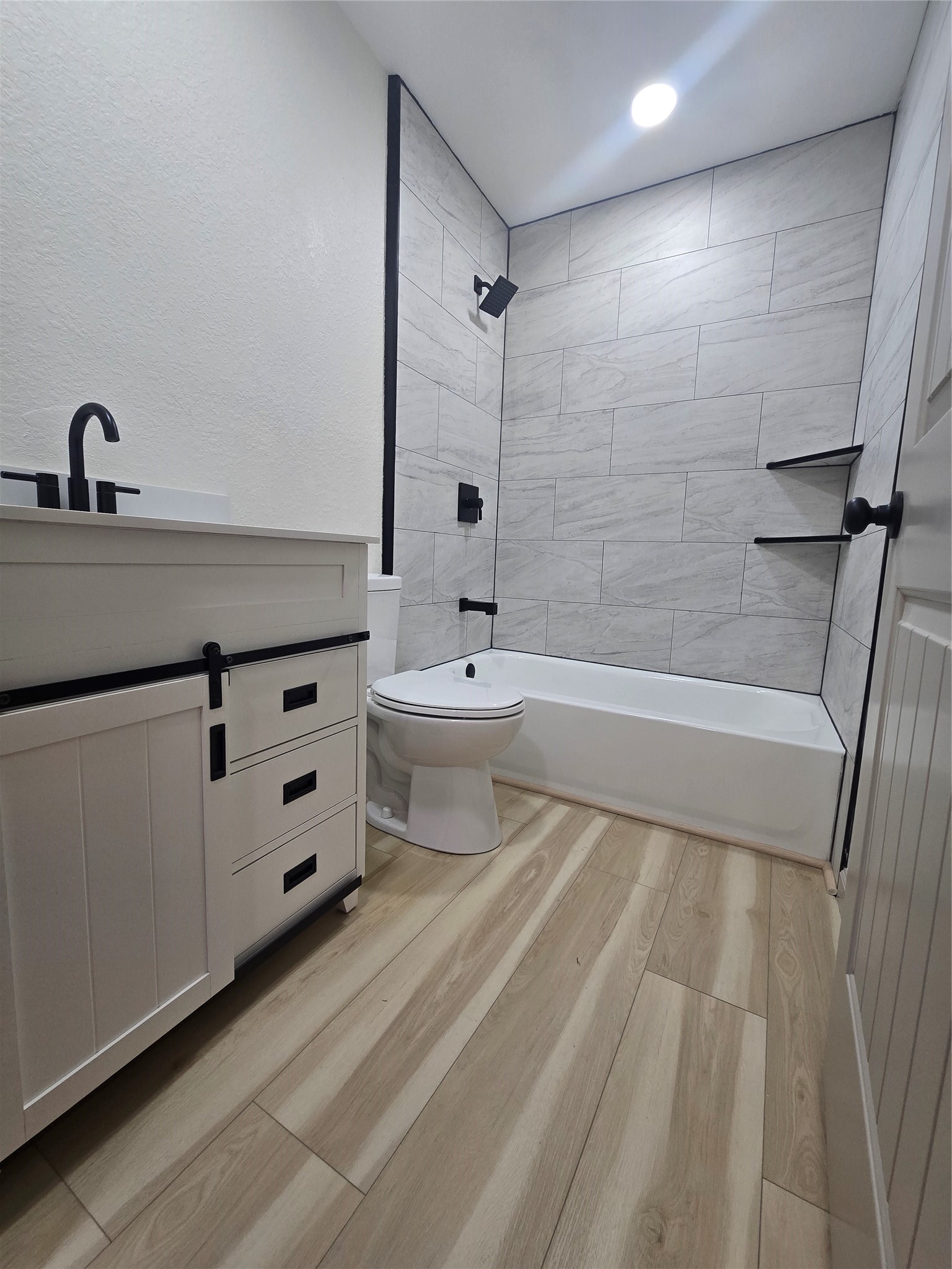 58 Hybiscus Court Lake Jackson, TX 77566 - Photo 13 of 21 a bathroom with a sink a toilet and shower
