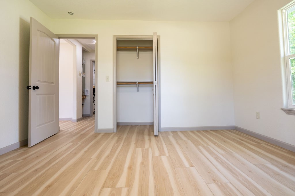 58 Hybiscus Court Lake Jackson, TX 77566 - Photo 14 of 21 a view of a room with wooden floor and a bathroom