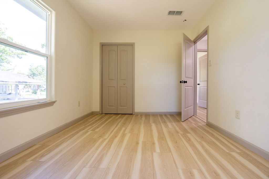 58 Hybiscus Court Lake Jackson, TX 77566 - Photo 15 of 21 a view of an empty room and window
