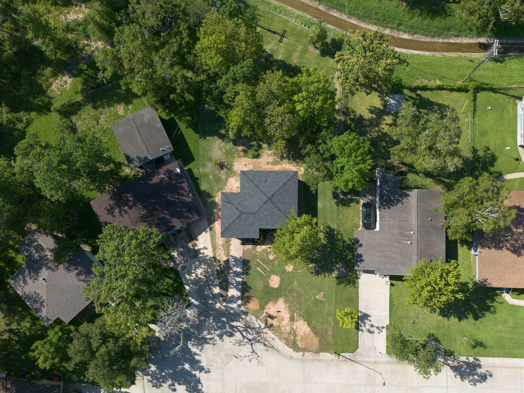 58 Hybiscus Court Lake Jackson, TX 77566 - Photo 21 of 21 an aerial view of a house with a yard and garden