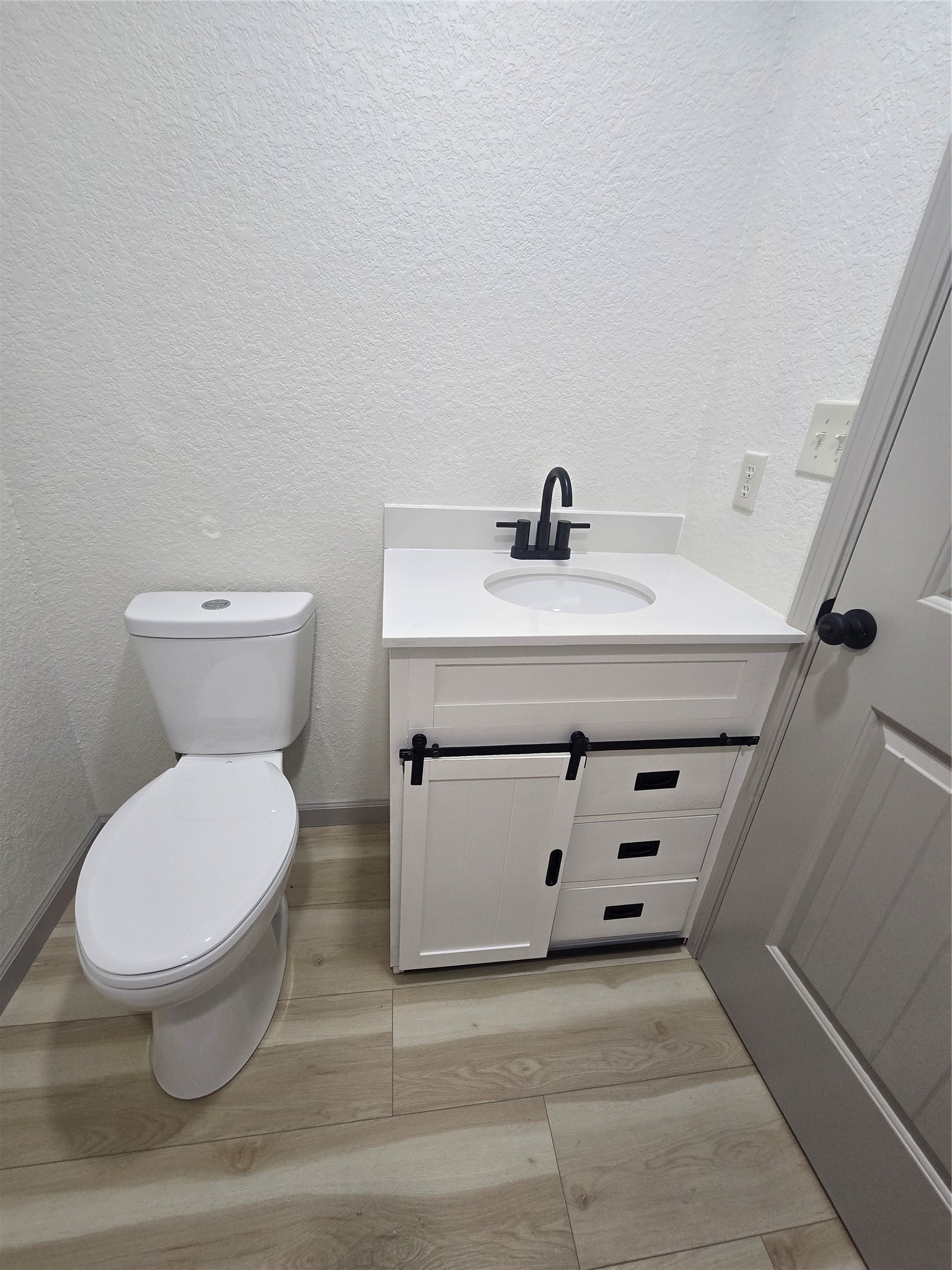 58 Hybiscus Court Lake Jackson, TX 77566 - Photo 8 of 21 a bathroom with a sink a toilet and mirror