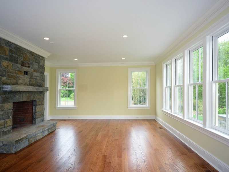 569 Middlesex Road Darien, CT 06820 - Photo 12 of 25 a view of an empty room with wooden floor and a window