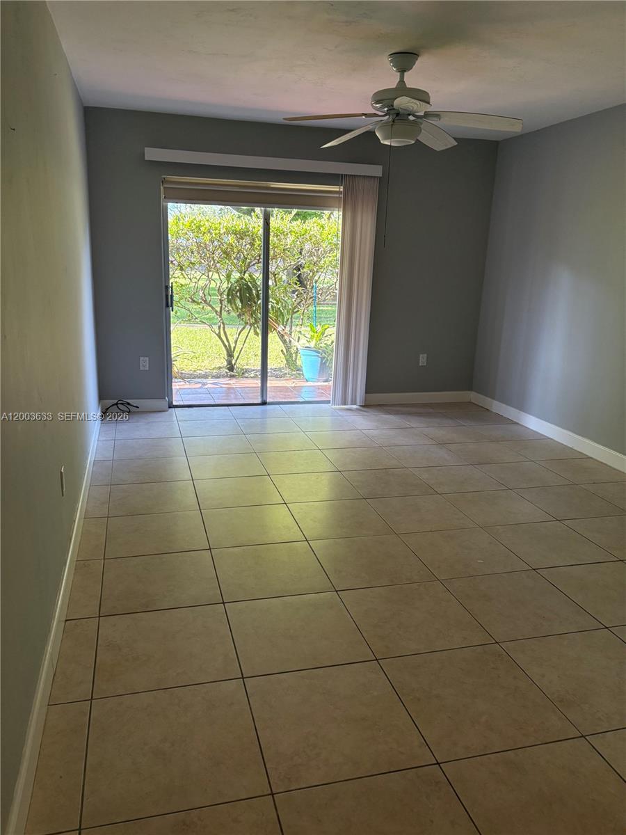 8335 Southwest 72nd Avenue, Unit 108D Miami, FL 33143 - Photo 11 of 20 a view of an empty room with a window