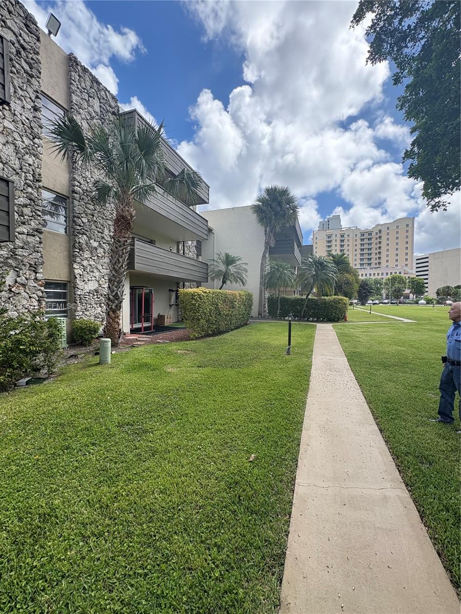 8335 Southwest 72nd Avenue, Unit 108D Miami, FL 33143 - Photo 15 of 20 a view of a house with a yard