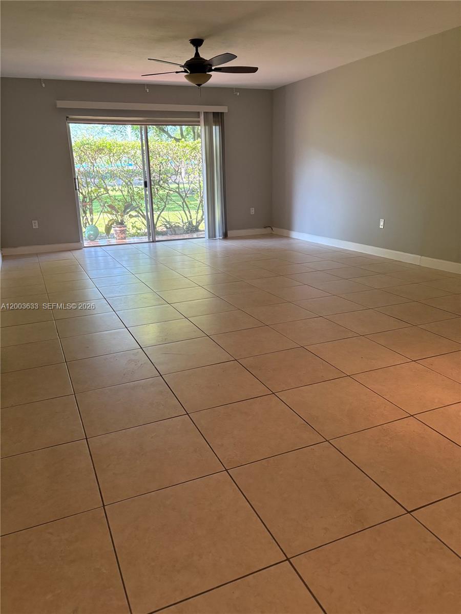 8335 Southwest 72nd Avenue, Unit 108D Miami, FL 33143 - Photo 2 of 20 a view of an empty room with a window