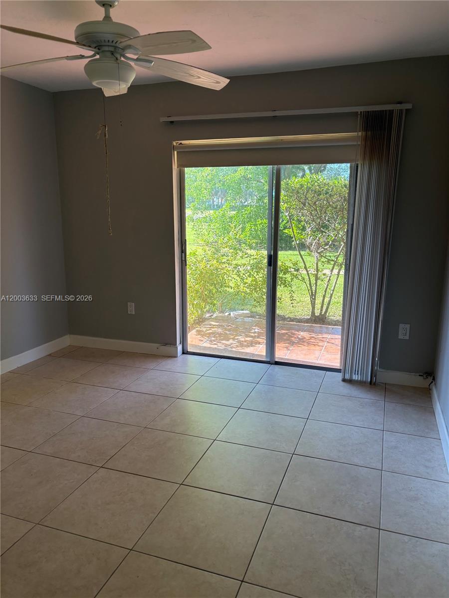 8335 Southwest 72nd Avenue, Unit 108D Miami, FL 33143 - Photo 6 of 20 a view of an empty room with a window