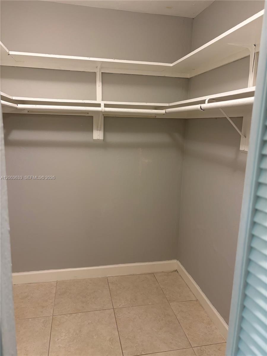 8335 Southwest 72nd Avenue, Unit 108D Miami, FL 33143 - Photo 7 of 20 a view of an empty walk in closet