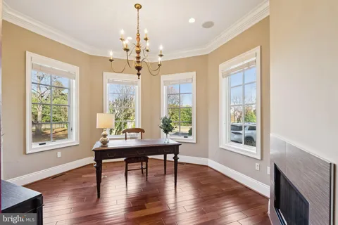 a view of a livingroom with furniture window and wooden floor