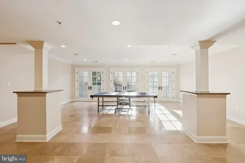 a patio with a table and chairs