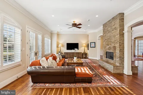 a living room with furniture fireplace and a flat screen tv