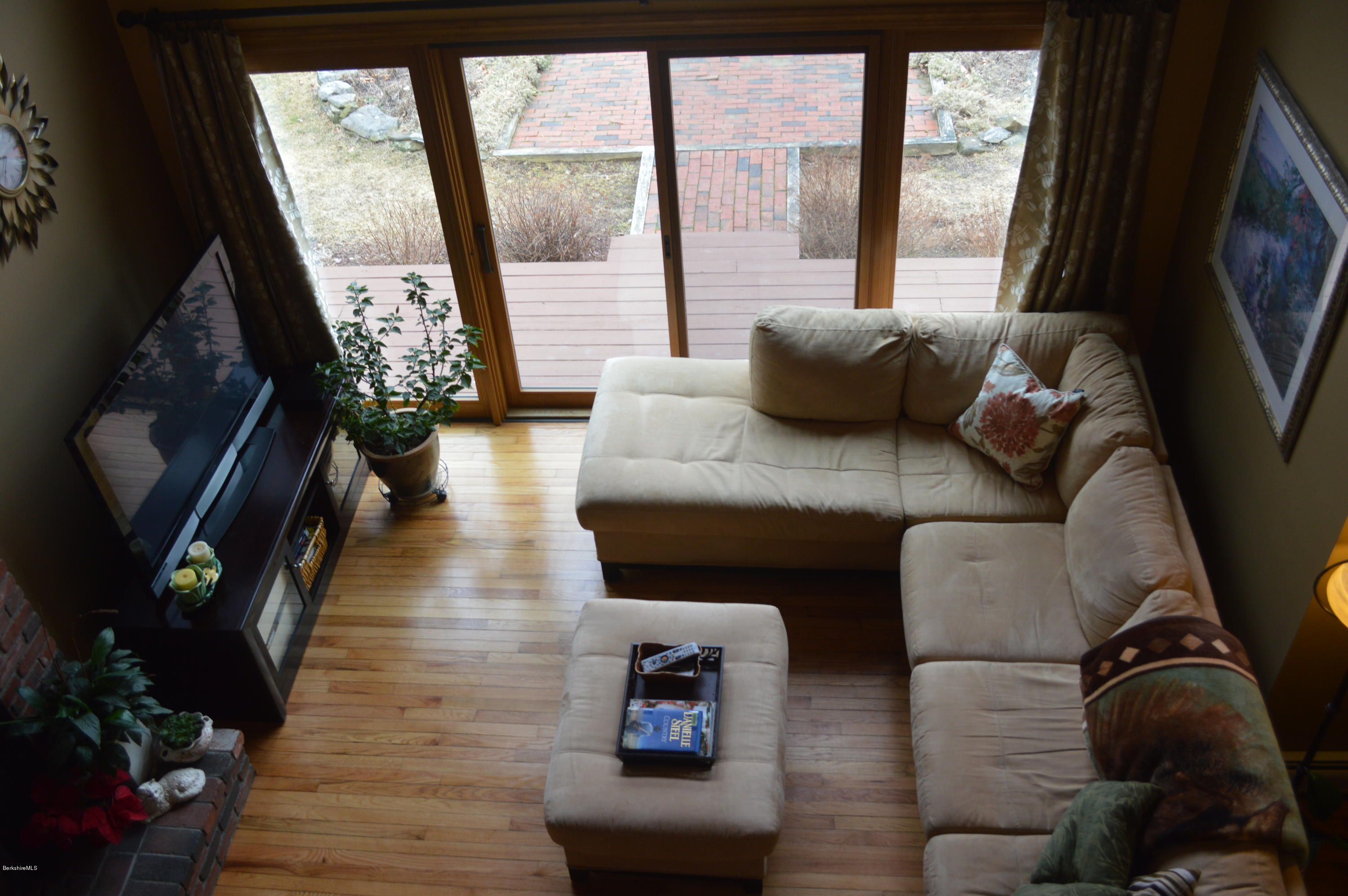 759 George Carter Road Becket, MA 01223 - Photo 15 of 56 a living room with furniture and a flat screen tv