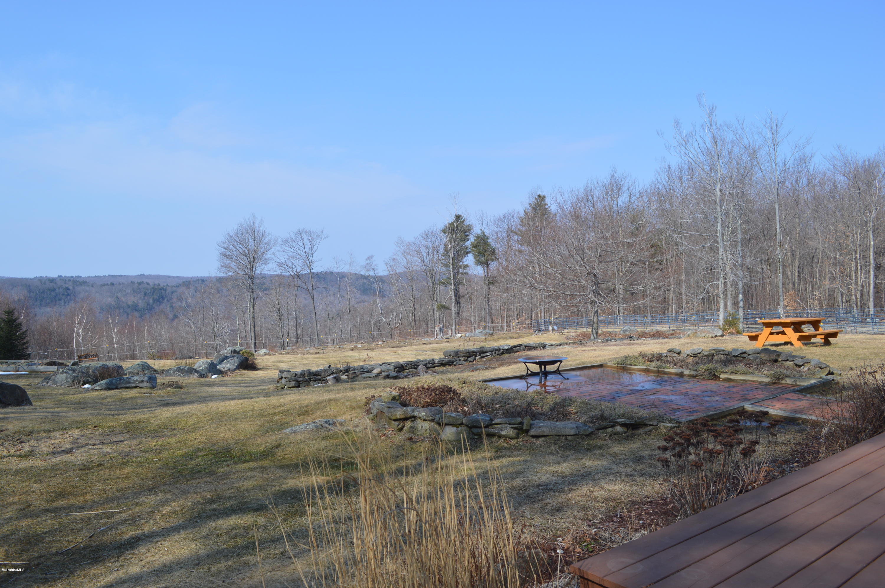 759 George Carter Road Becket, MA 01223 - Photo 19 of 56 a view of swimming pool with a yard