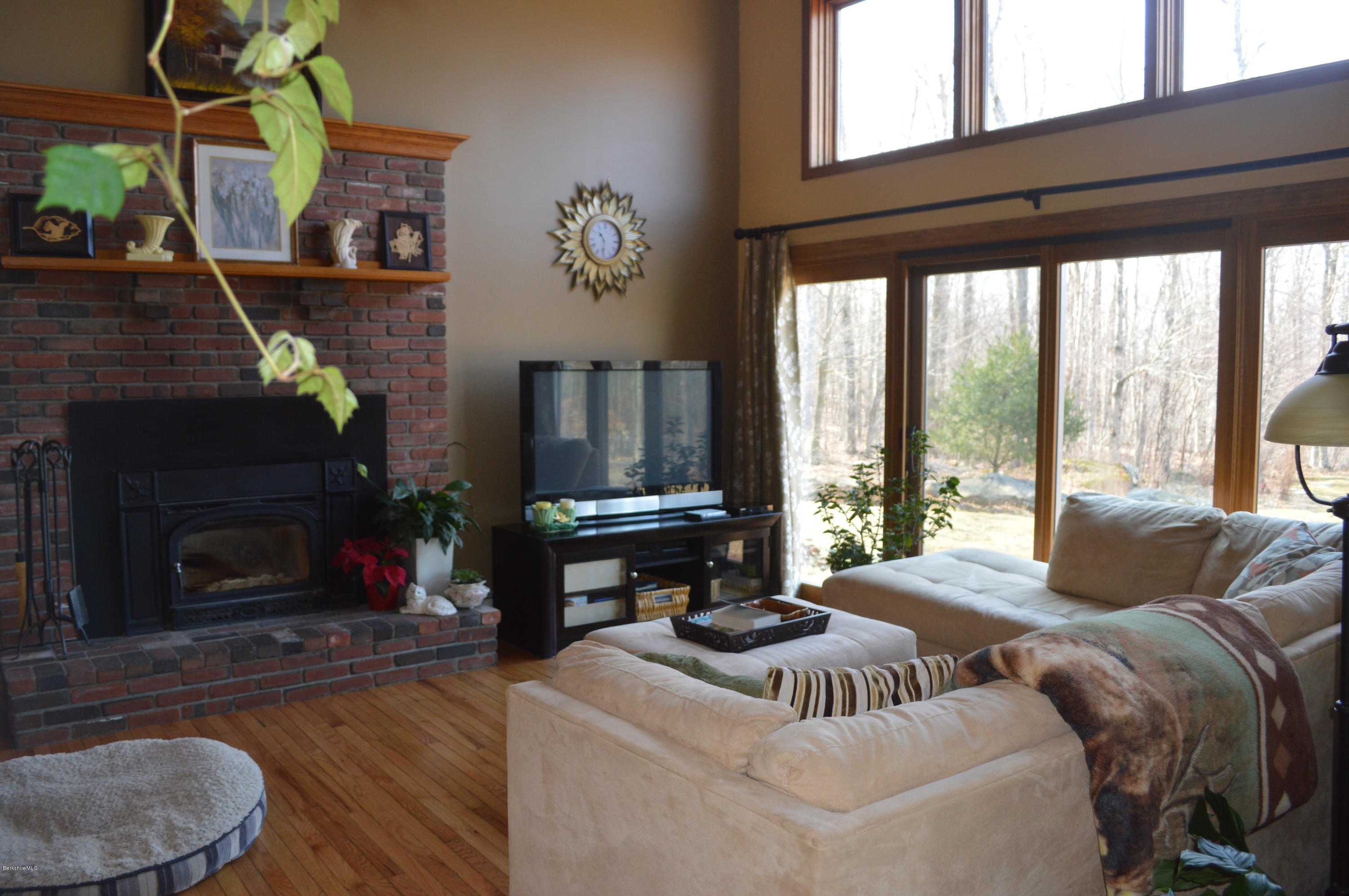 759 George Carter Road Becket, MA 01223 - Photo 3 of 56 a living room with furniture and a fireplace